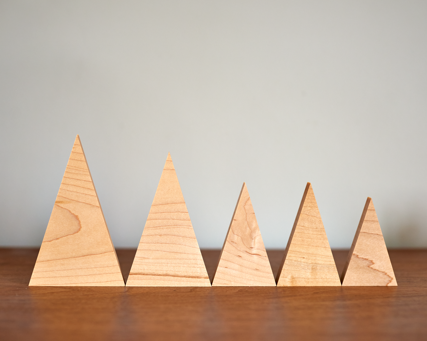 collection of tree family decorations in available sizes in Solid Maple