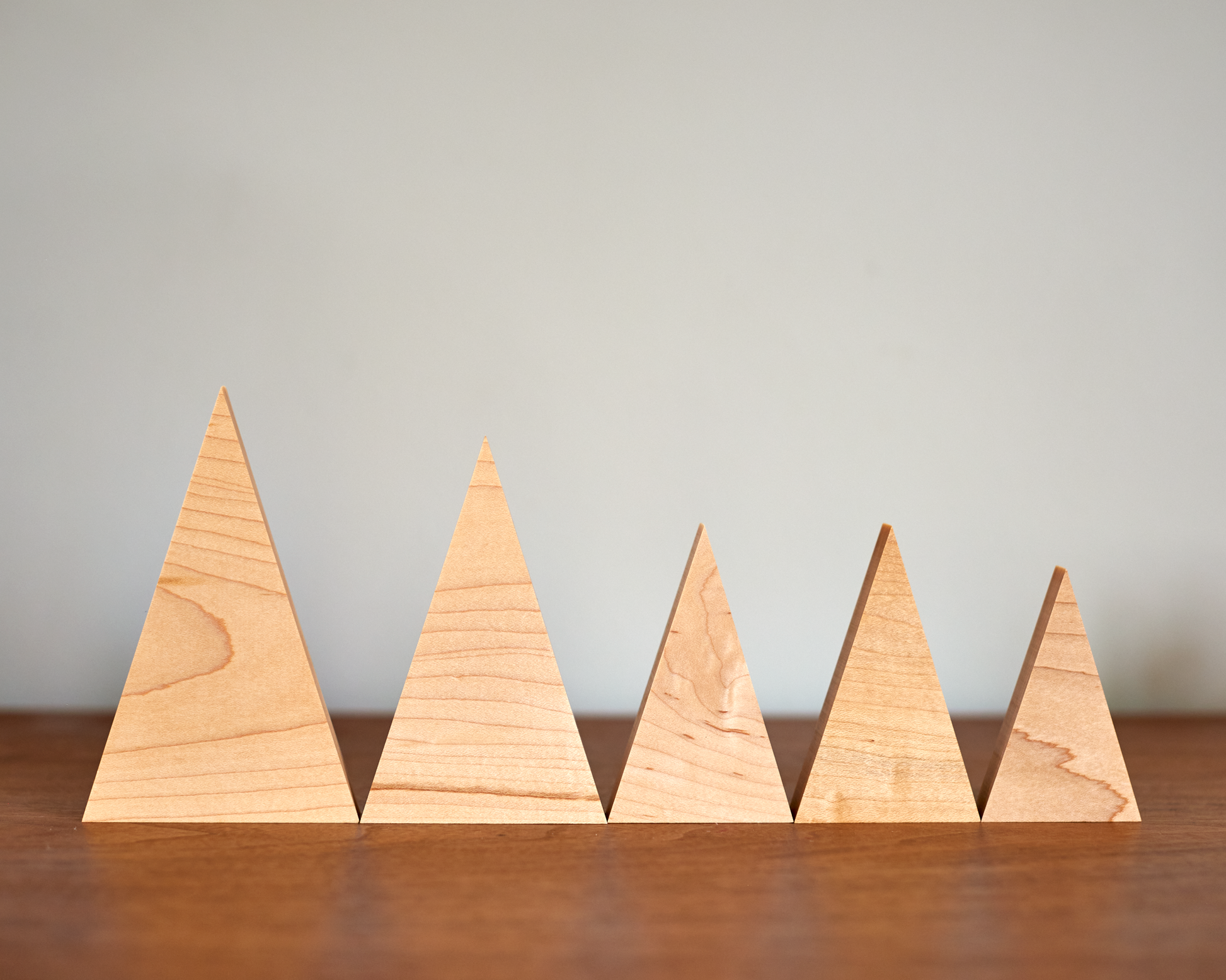 collection of tree family decorations in available sizes in Solid Maple