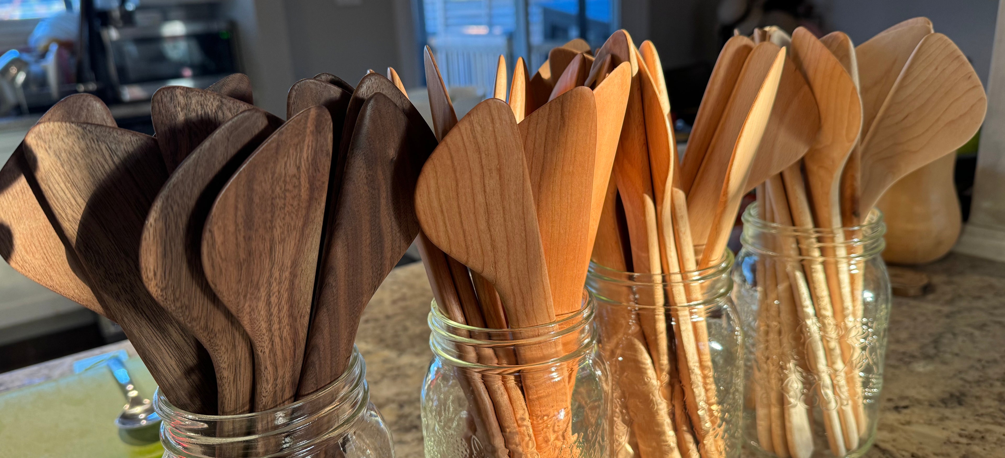 A selection of hand made cooking spatulas in Walnut, Cherry, European Beech and Maple
